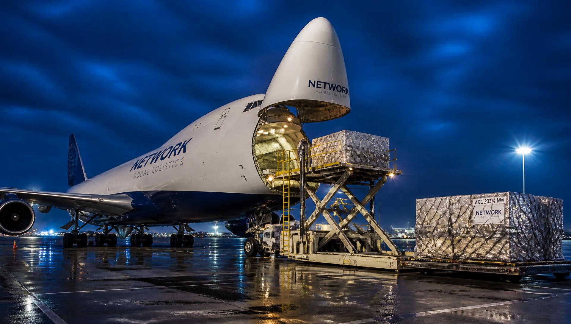 Cargo aircraft being loaded at night